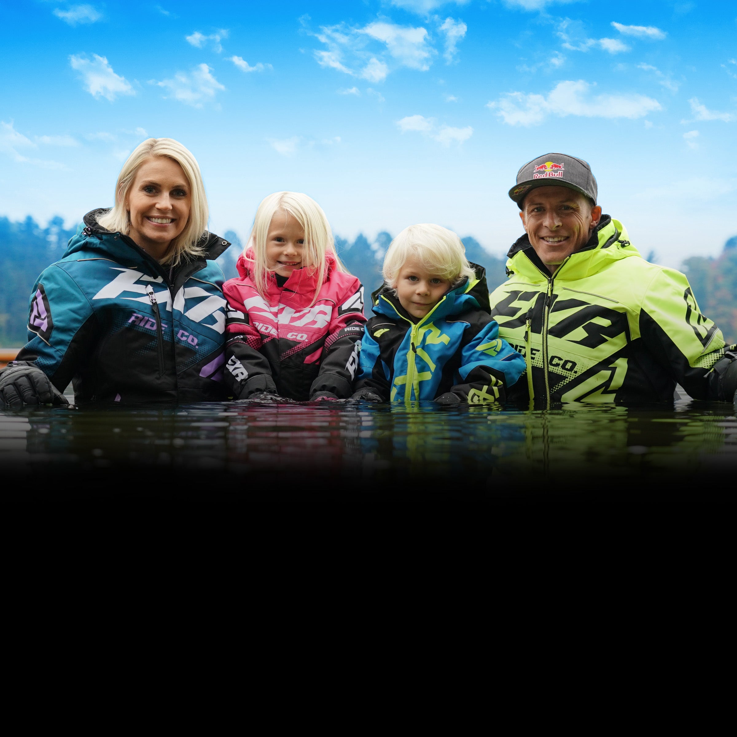 An image of family of four wearing snow jackets with FXR's F.A.S.T Technology